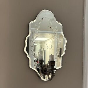 Anthropologie mirror candle wall sconce.16”x9.5”. Mirror has an antique finish.